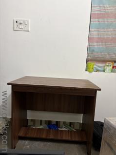 Wooden Table New table can be used as laptop,computer and study purpose bought 2 weeks ago selling due to shifting to other city for work reason price negotiable