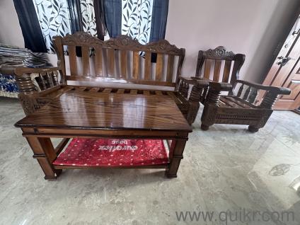 A set of wooden sofa set with centre table