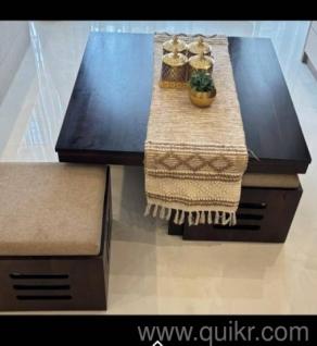 Coffee table with 4 puffies. sheesham wood. less than year old. plus bed side storage table