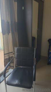 Bed with Memory foam mattress and wooden table with storage and chair.