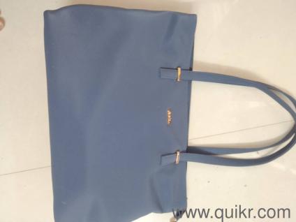 it's a grey blue shine color hand bag for office or even travel it's new .