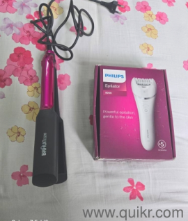 Unused hair straightener (Braun) and electric razor (Philips)