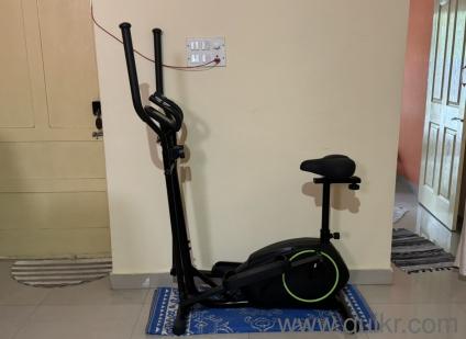 elliptical cross trainer with a built-in exercise bike seat