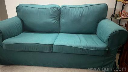 sofa bought from Ikea 2 years ago and a teakwood sofa with 3+1+1 and a center table 