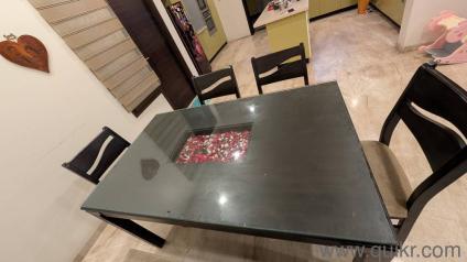 Modern 6 seater dining table with glass top