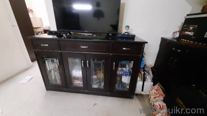 Gently used TV cabinet with glass doors and shlefs