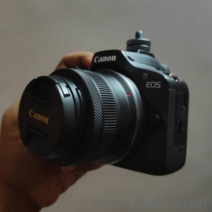 Canon R100 with the kit lens ( 18-45mm ) and RF 50mm f(1.8)