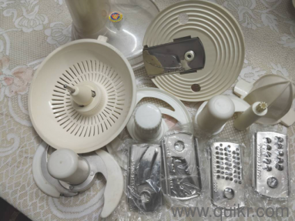 One Bajaj Platini food processor 600 Watts with 11 different functionaries 3 speed control in good working condition