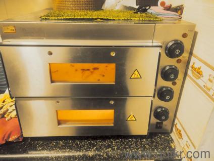 it's a commercial oven ,it's good with working condition just handles are not there,don't know the exact brand,can visit &check