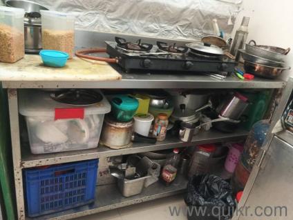 stainless steel counter with 2 shelfs.