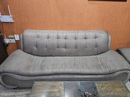 Solid wood frame and fabric cushioned designer sofa set.
