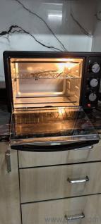 Pigeon 25L Convection Oven Toaster Grill features a 25L capacity, 1600W power, rotisserie function, and versatile cooking options.