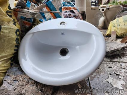 One Sink Washbasin and Two Used commodes with one flush tank
