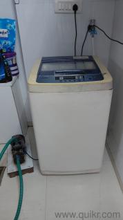The washing machine is in good condition, but there are few scratches on the machine. It is in white colour and it takes less water.