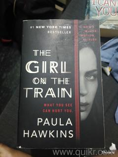 The Girl on the Train by Paula Hawkins, a bestselling psychological thriller and mystery novel