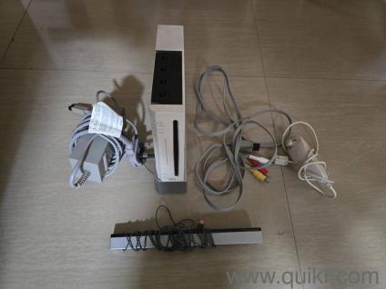 Nintendo Wii Console (without remote) and 2 CDs