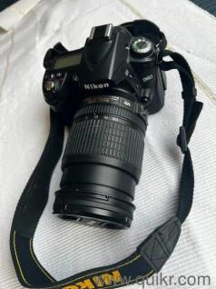Nikon D90 DSLR camera body + original lens 70-300 mm lens + original charger + original battery + charging cable + carry belt + nikon carry bag + memory card adapter+ OTG + 16 GB memory card.