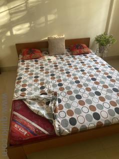 Wooden bed with kurl on Mattress , queen size