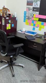 Revolving chair with table 