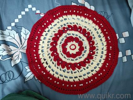 Thal podh (woolen work some white stones in it )