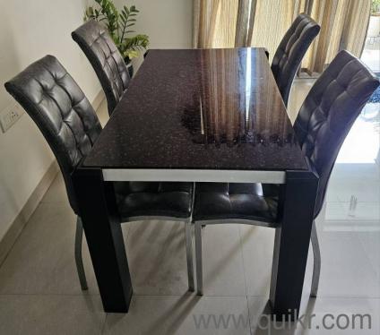 A modern 4-seater dining table for sale