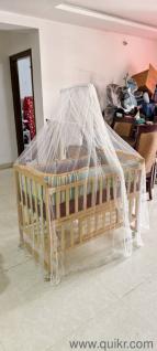 babyhug cradle with mattress, net and side cushion 