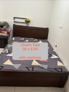 Queen size wooden bed with mattress