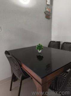 rectangle shaped teak wood glass top finished dining table