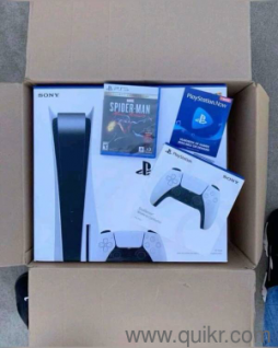 98732..73716 sony playstation ps5 in warrant with 2 controllers and 4 gaming cds 