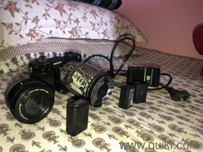 Sony A6300 mirrorless camera with kit lens Sigma 16 mm f/1.4 three battery & charger With bag