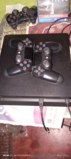 PS4 slim 2tb jailbreak 11.00 with 30 plus games loaded and 2 controllers 