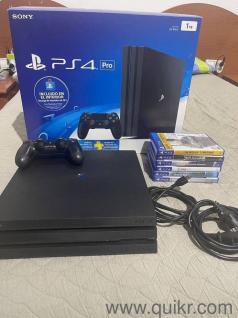 98732..73716 sony playstation ps4 pro 1tb with 2 controller and 4 gaming cds 1 year warranty 