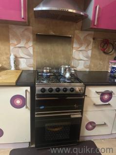 Cooking range with burner,oven,grill and chimney 