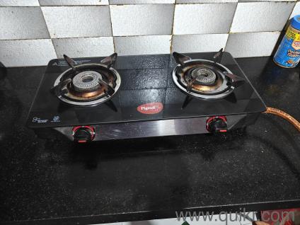 Two burner gas stove, gas hose and a lighter