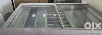 Glass door deep freezer with ice cream scoop setup and glass door show case for bakery