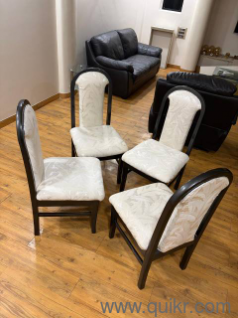 Gently used 4 elegant Teakwood Dining Chairs