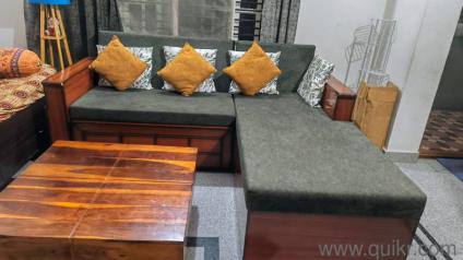 5-seater L-shaped sofa cum bed with centre table for sale