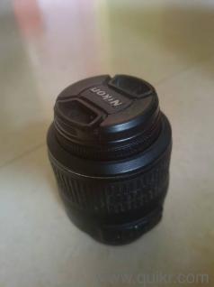 The lens in the image is a Nikon AF-S DX NIKKOR 18-55mm f/3.5-5.6G.