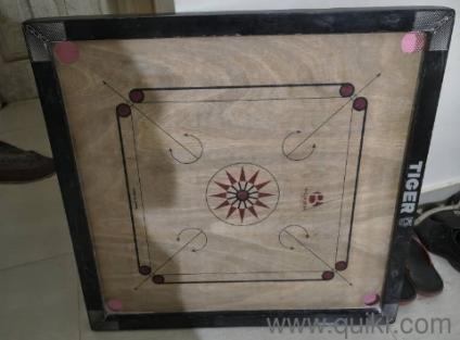 Carrom Board along with Carrom Coins and Striker