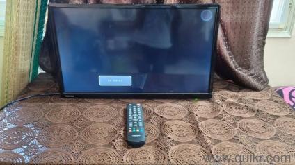 Toshiba 22-inch monitor in good working condition. Includes stand. Small coin-sized black spot in the top-right corner