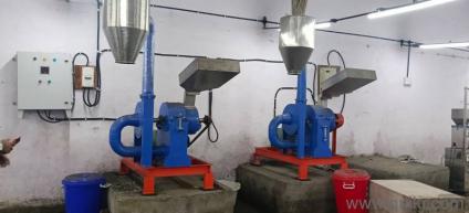 this is a masala grinder machine with masala packaging machine 