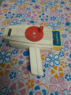 selling kids movie projector, rotating it through a handheld device