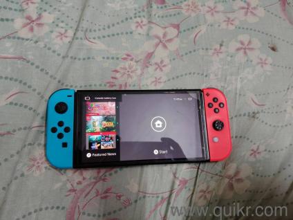 Nintendo switch oled with games worth 9 k and 128 microsd card and back case and case to carry