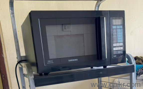 The Samsung CE103VD is a combination convection microwave oven (typically 28 liters capacity) featuring grill, convection, and microwave cooking modes 