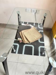 Glass dining table with chairs