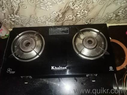 two burner gas stove only used few months with a 14.6 kg gas cylinder and regulator pipe 