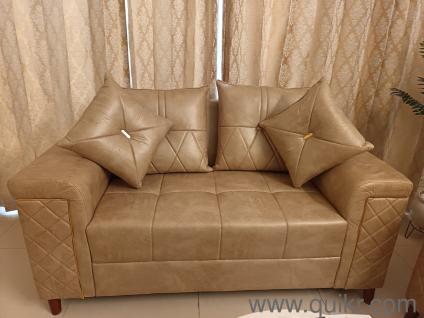 2 seater fabric sofa with leather look. It comes with 4 cushions. It is completely new. Selling as it is big for my space. Very high quality sofa. At great discounted price.