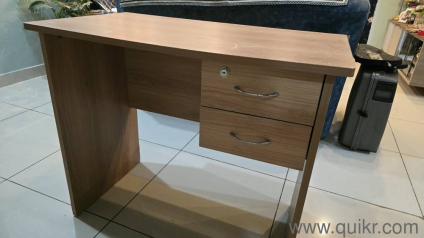 Wooden study table with drawers