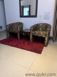 2 sofa chairs with table