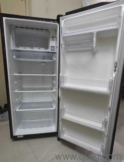 Wine Red Coloured Fridge with a single door. It is in complete working condition.